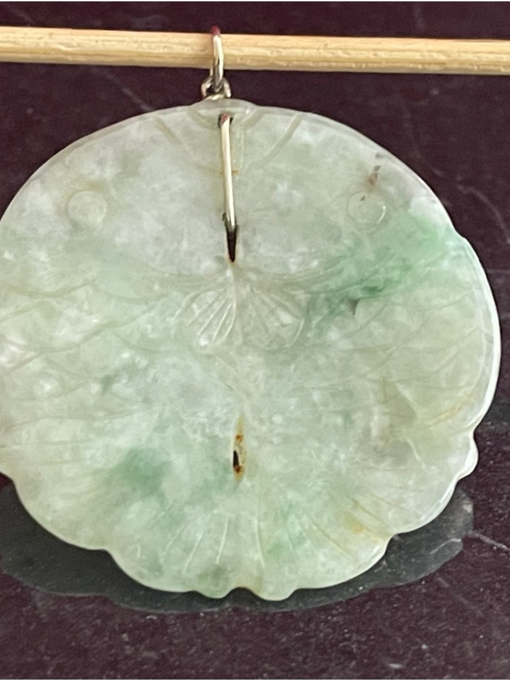 Carved jadeite double fish pendant.